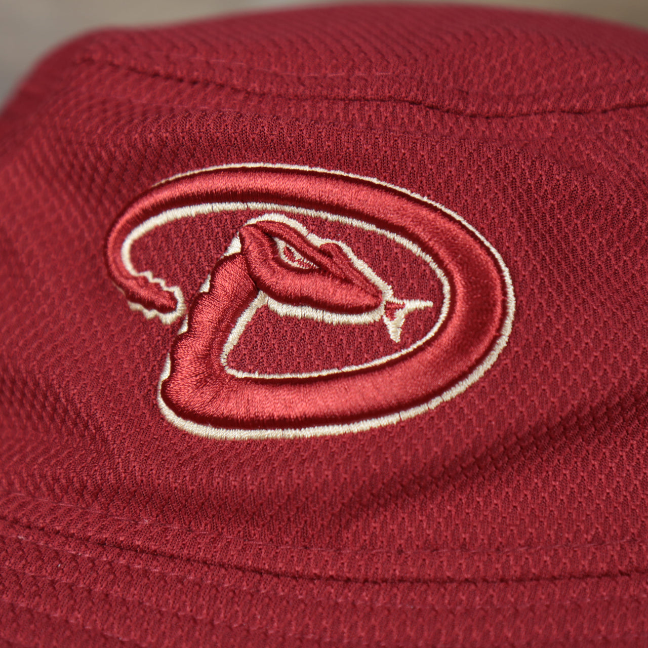 A close up of the Diamond Backs logo on the Arizona Diamond Backs MLB 2022 Spring Training Onfield Bucket Hat
