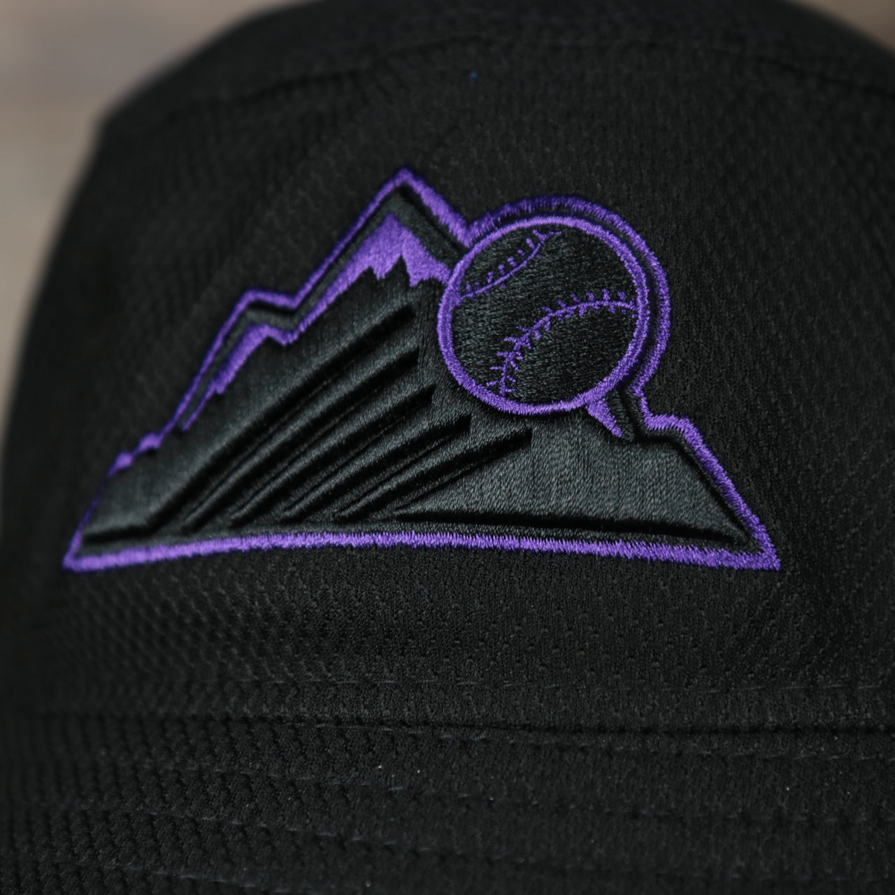 A close up of the Rockies logo on the Colorado Rockies MLB 2022 Spring Training Onfield Bucket Hat