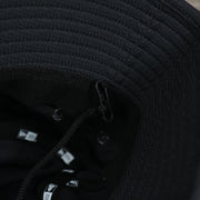 A close up of the removeable chin strap that is on the Atlanta Braves MLB 2022 Spring Training Onfield Bucket Hat