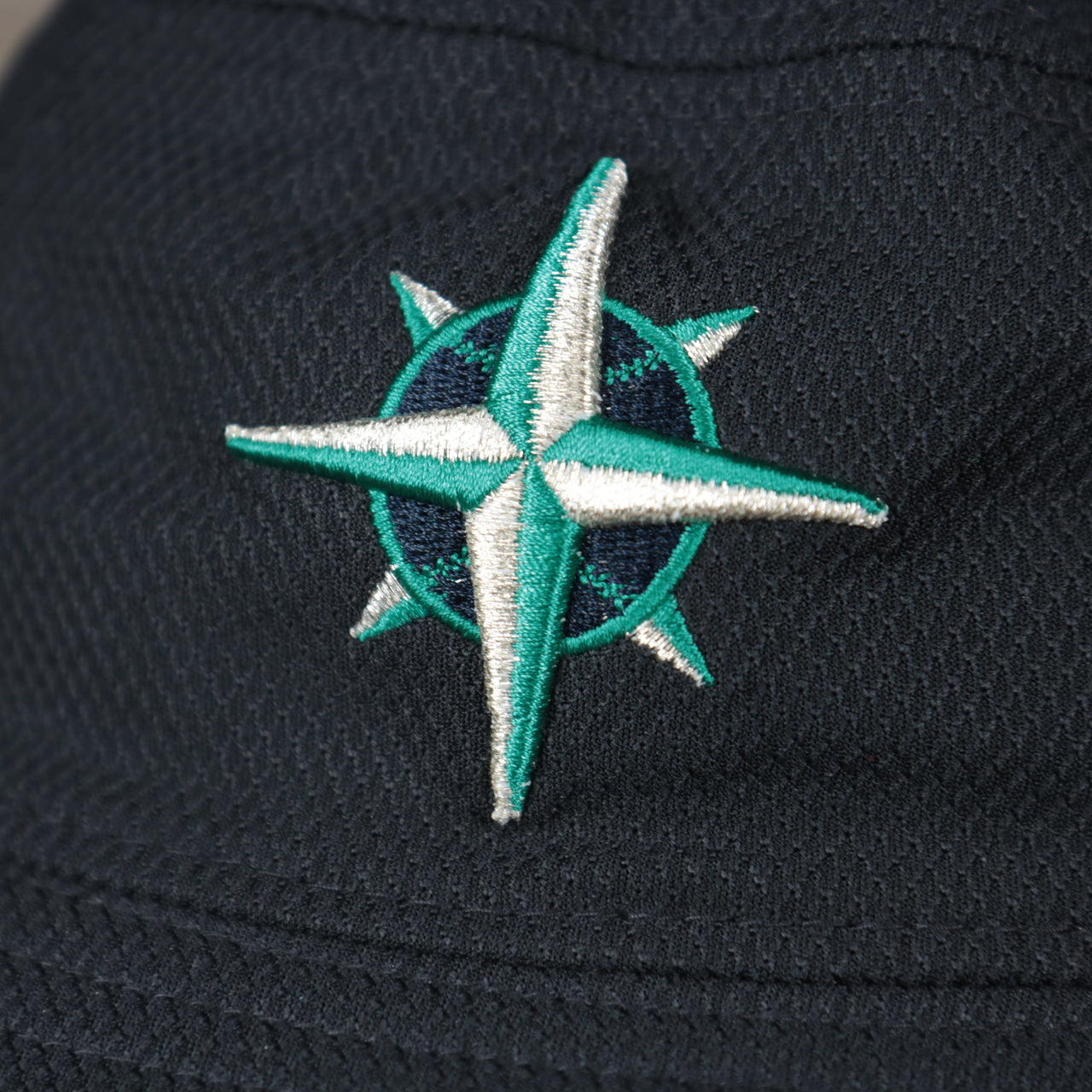 A close up of the Mariners logo on the Seattle Mariners MLB 2022 Spring Training Onfield Bucket Hat
