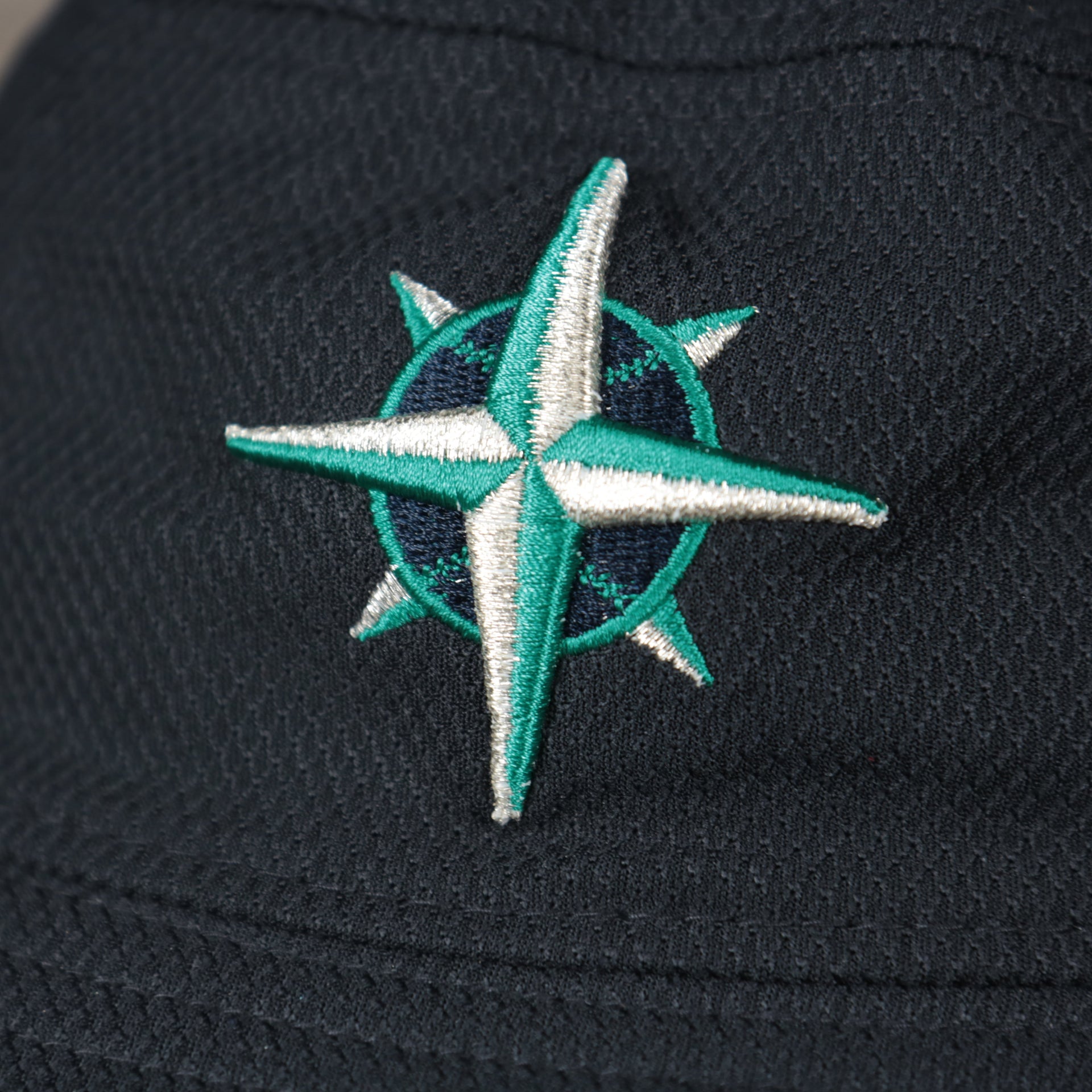 A close up of the Mariners logo on the Seattle Mariners MLB 2022 Spring Training Onfield Bucket Hat