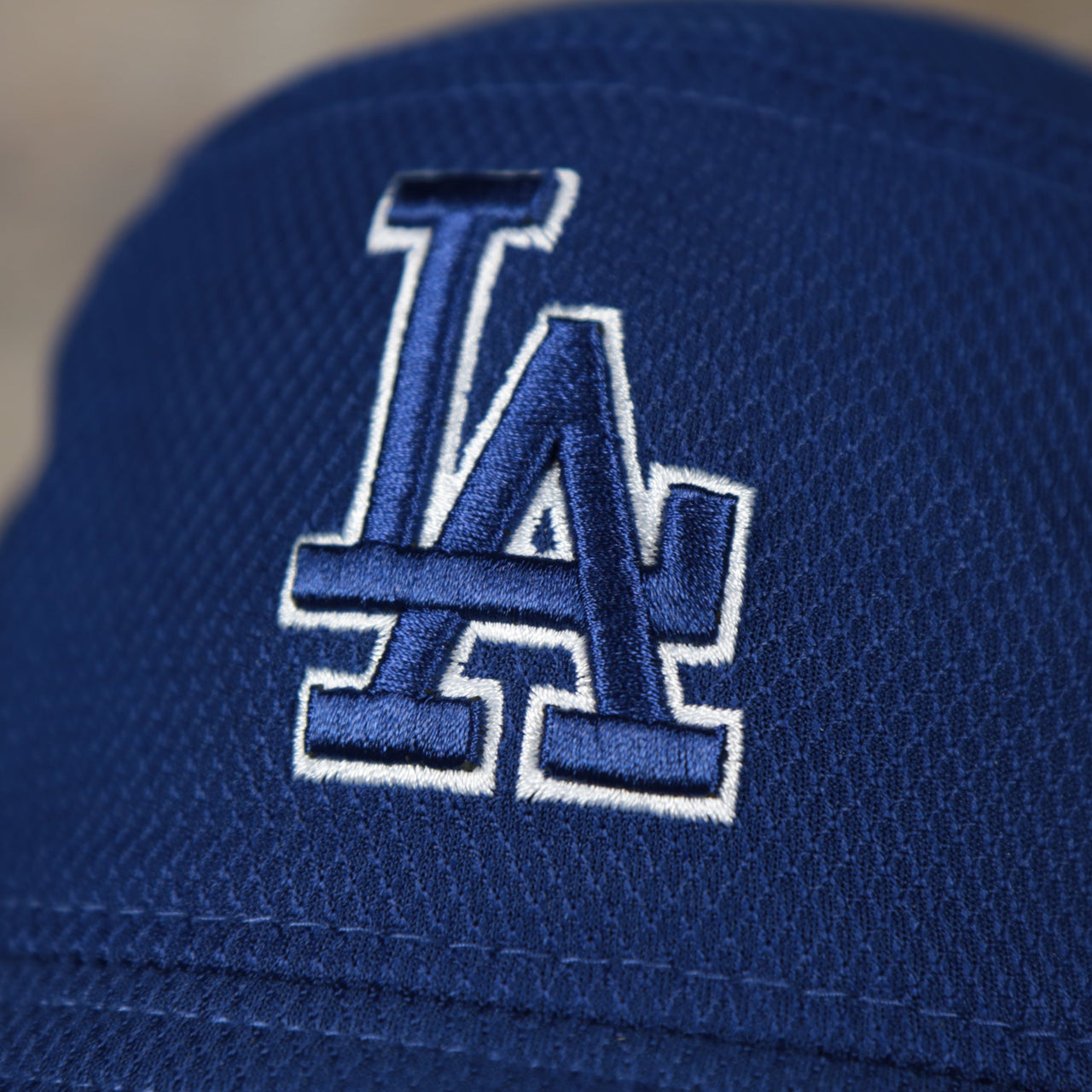 A close up of the Dodgers logo on the Los Angeles Dodgers MLB 2022 Spring Training Onfield Bucket Hat