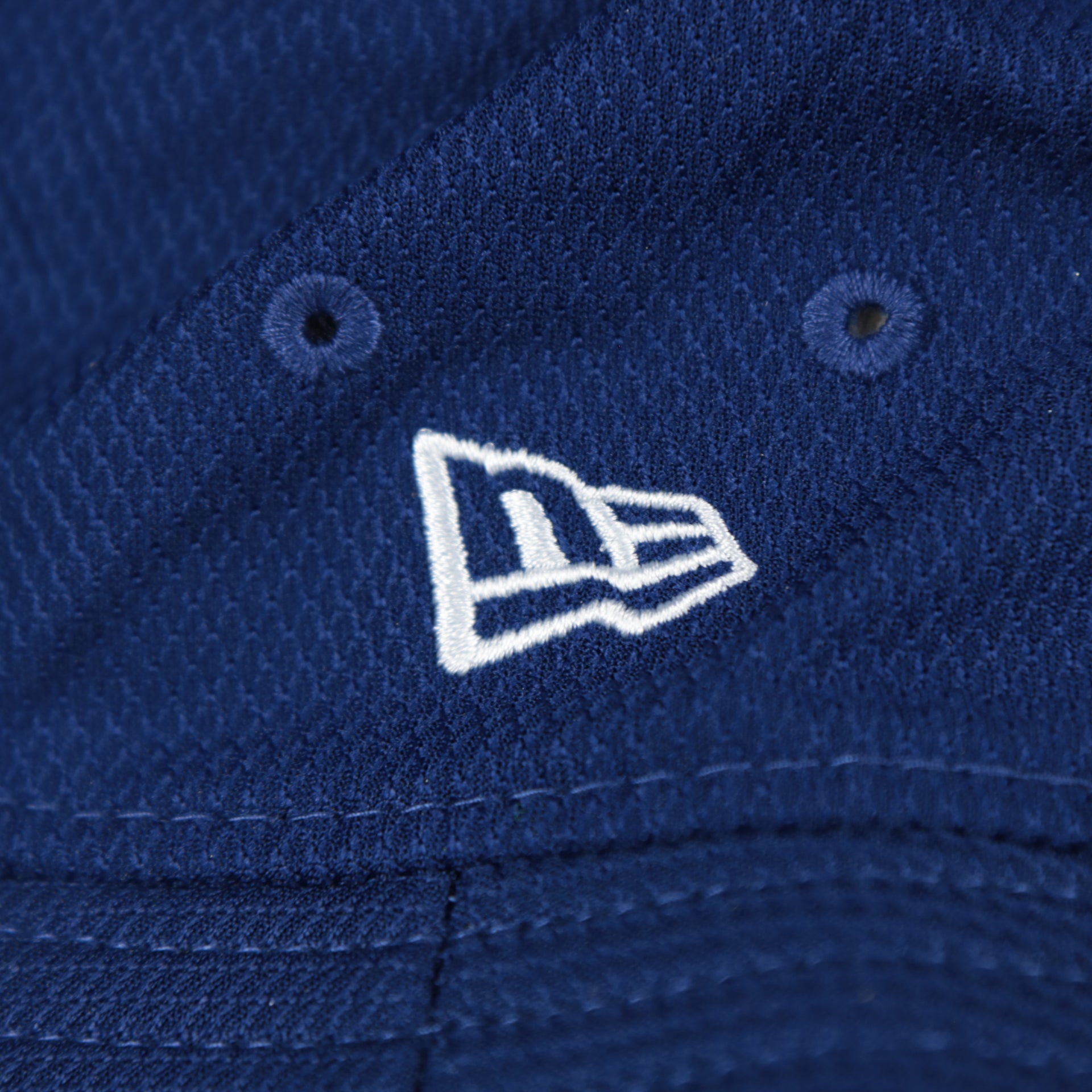 A close up of the New Era logo on the Los Angeles Dodgers MLB 2022 Spring Training Onfield Bucket Hat