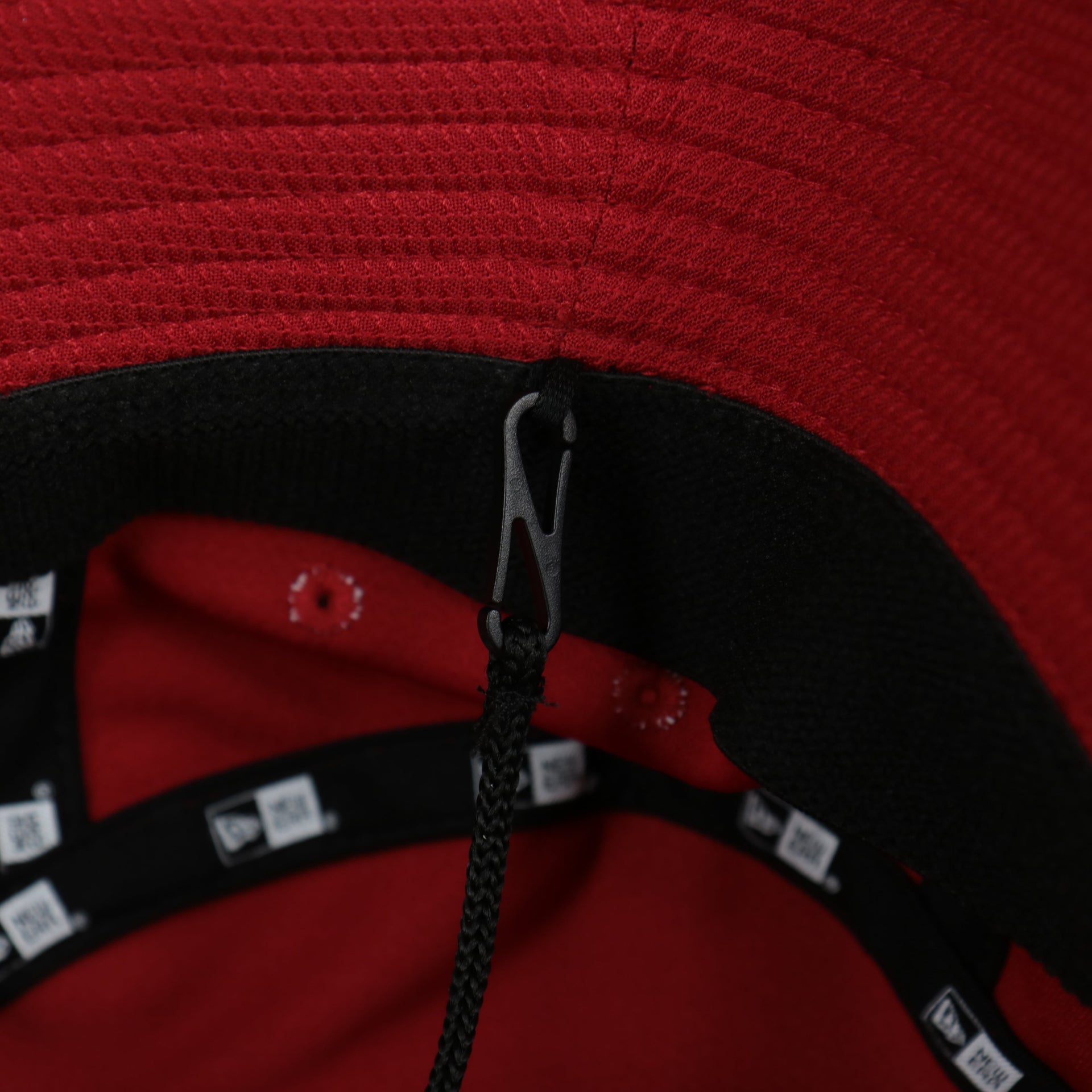 A close up of the removable chin strap on the Washington Nationals MLB 2022 Spring Training Onfield Bucket Hat