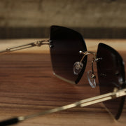 The inside of the Large Lightweight Frame Black Lens Sunglasses with Gold Frame