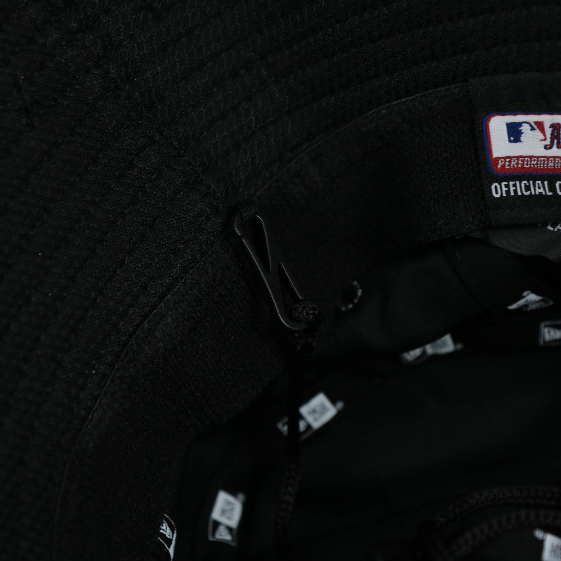 A close up of the removeable chin strap on the Chicago White Sox MLB 2022 Spring Training Onfield Bucket Hat