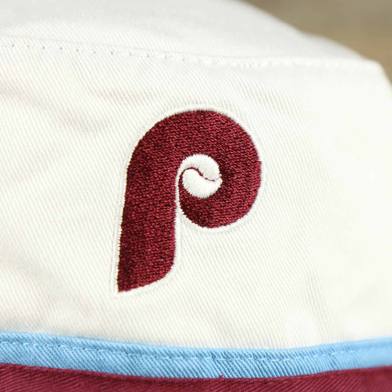 The Vintage Phillies Logo on the Cooperstown Philadelphia Phillies Striped Bucket Hat | White Bucket Hat