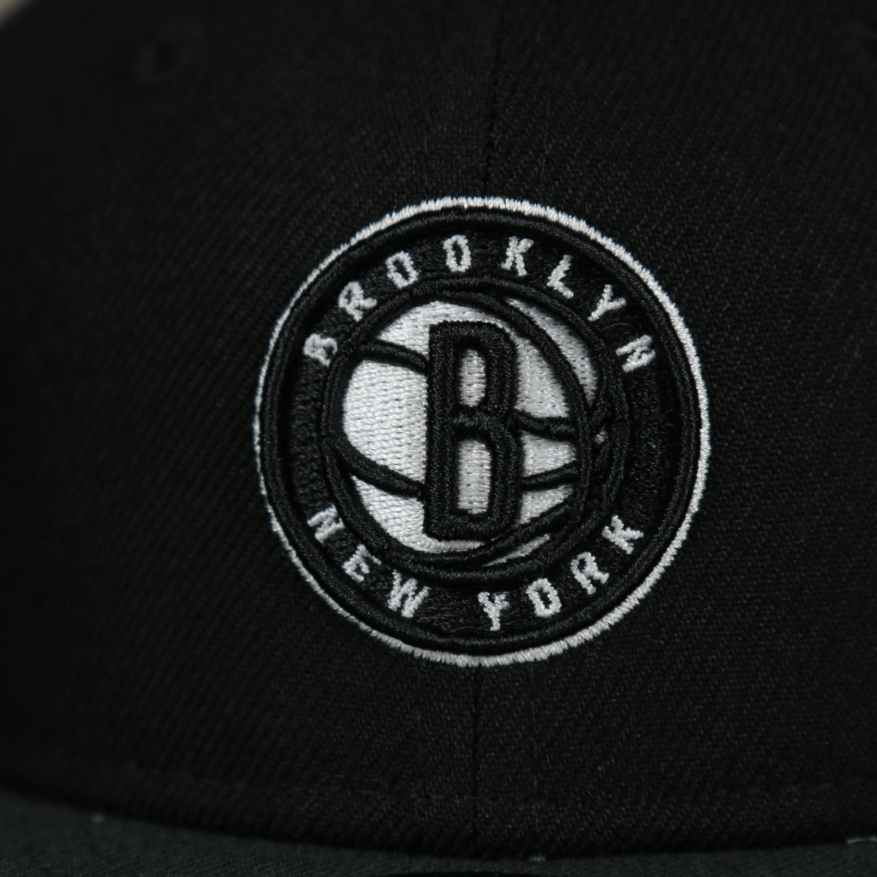 A close up of the logo on the Brooklyn Nets My 1st 9Fifty Snapback