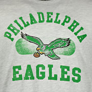 logo on the front of the Philadelphia Eagles Distressed Throwback Kelly Green Bird Logo Gray Brisk Franklin  T-Shirt