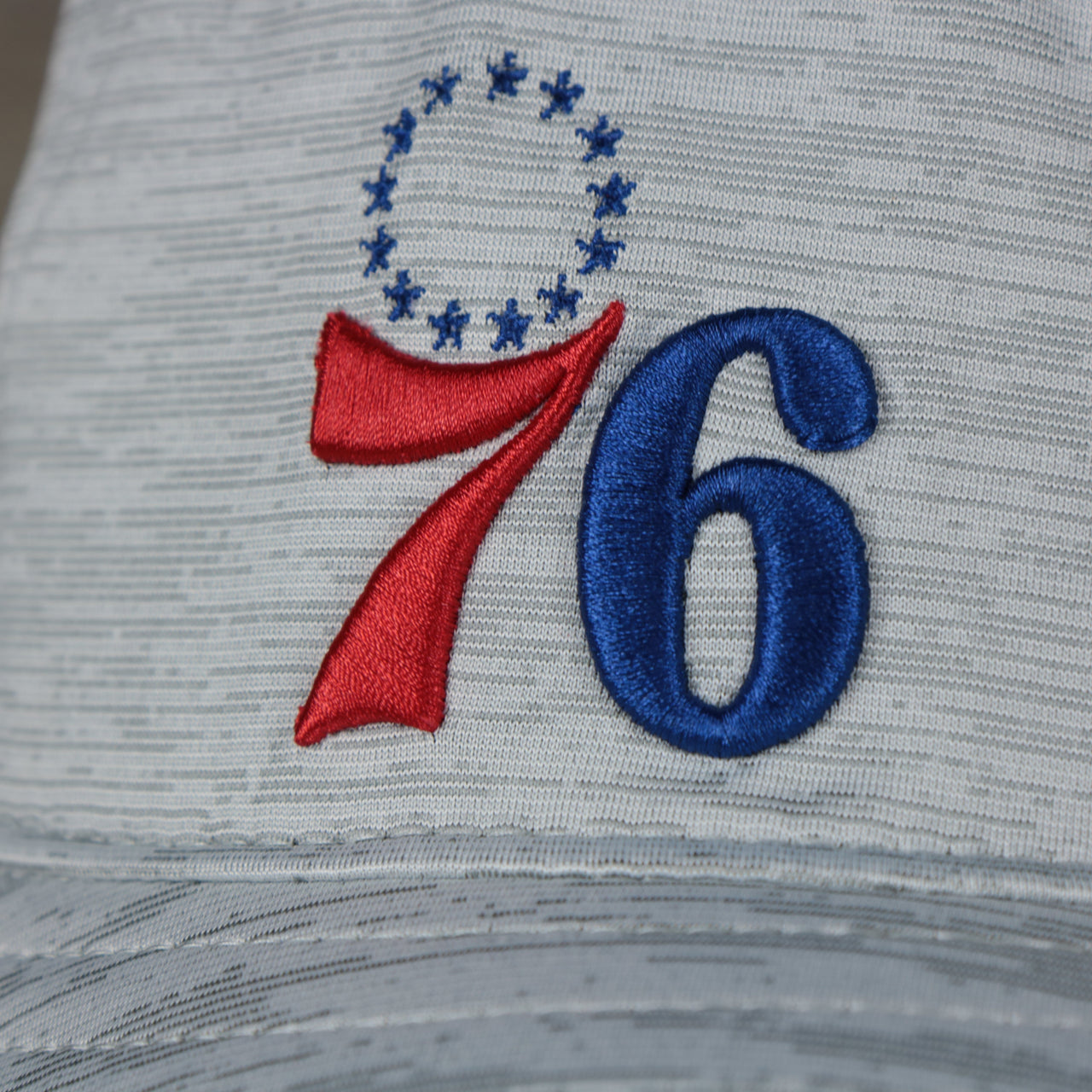 A close up of the 76ers logo on the Philadelphia 76ers New Era Bucket Hat