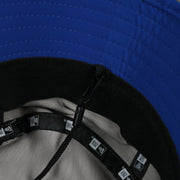 A close up of the removeable chin strap on the Philadelphia 76ers New Era Bucket Hat