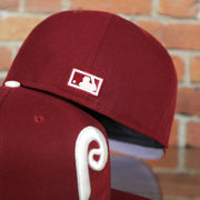 MLB cooperstown logo on the Philadelphia Phillies 1970s Cooperstown Vintage Cardinal Red New Era 59Fifty Fitted Cap