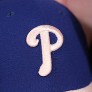 phillies logo on the Philadelphia Phillies 2019 Mother's Day Blue on Pink 39Thirty Flexfit Cap