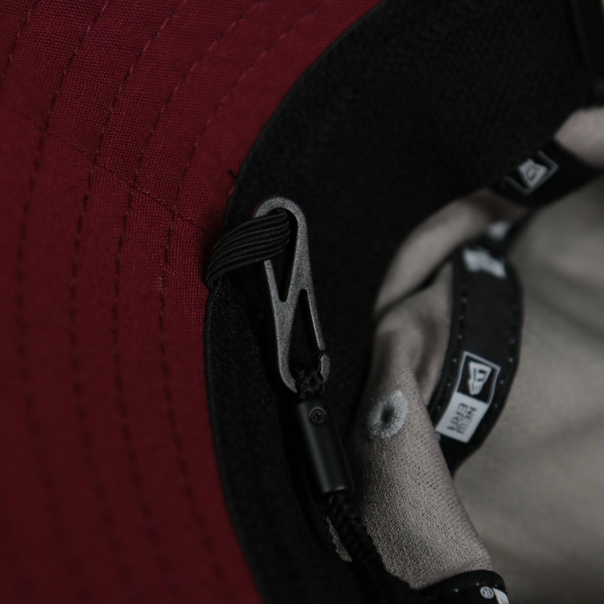 A close up of the removeable chin strap on the Philadelphia Phillies Cooperstown New Era Bucket Hat