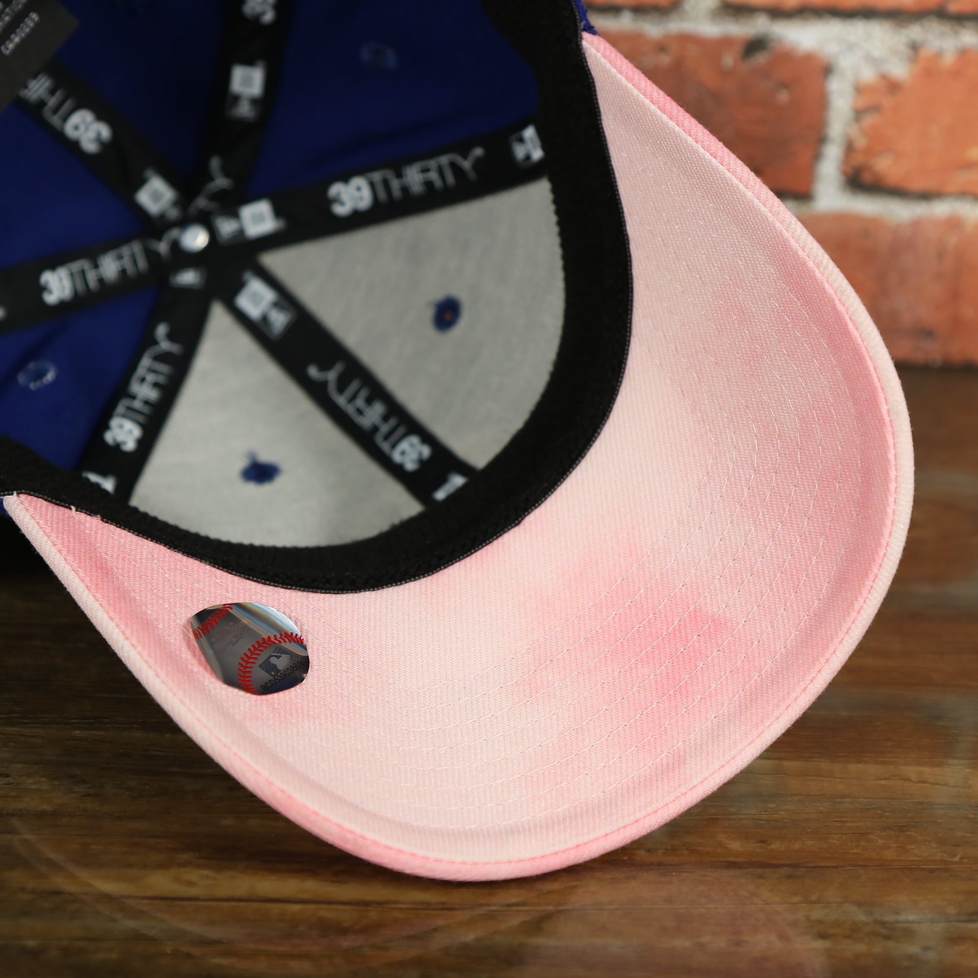 pink under visor on the Philadelphia Phillies 2019 Mother's Day Blue on Pink 39Thirty Flexfit Cap
