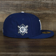The wearer's right on the Los Angeles Dodgers Jackie Robinson Side Patch 59Fifty Black Bottom Fitted Cap