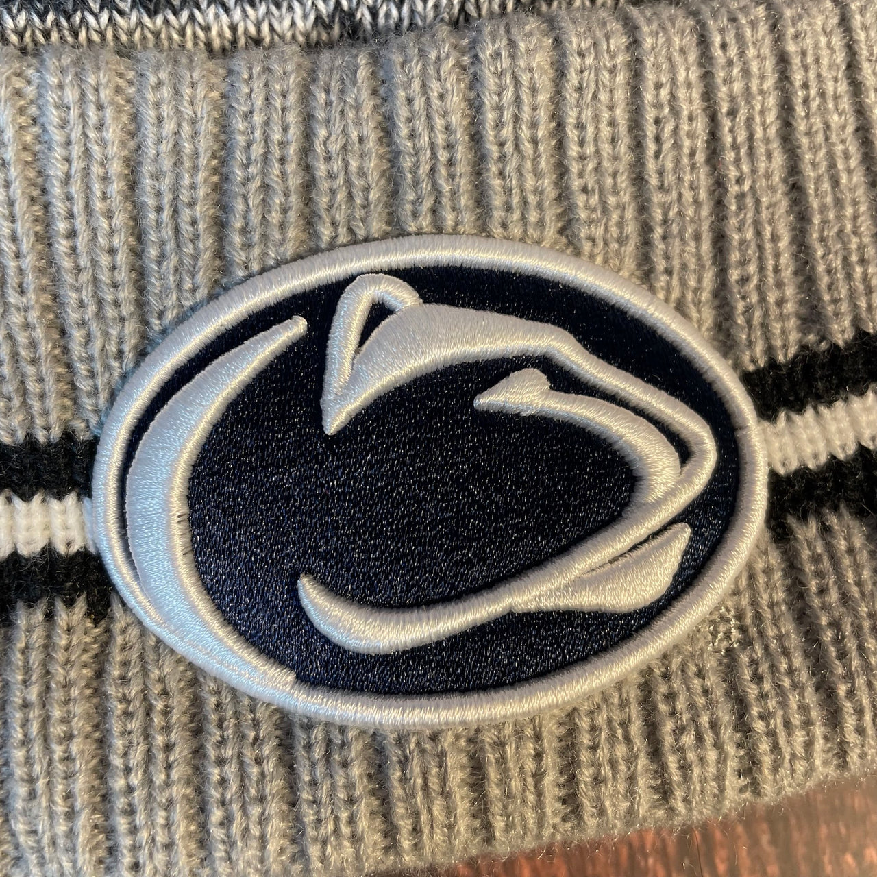 Close up of Penn State Nittany Lions logo at the front raised cuff