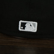 A close up of the MLB Batterman logo on the Chicago White Sox Jackie Robinson Side Patch 59Fifty Black Bottom Fitted Cap
