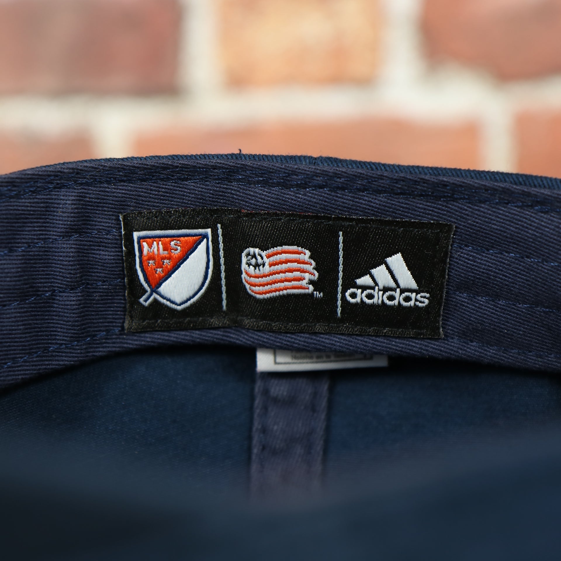 brand patch on the inside of the LA Galaxy American Flag Logo Navy Bottom MLS Slouch Cap | Navy OSFM