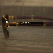 A close up of the hinge on the Rectangle 3 Row Frame Brown Gradient Lens Sunglasses with Gold Frame