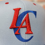 clippers logo on the front of the Los Angeles Clippers Vintage Logo Adjustable Snapback with Blue Under visor | Grey OSFM