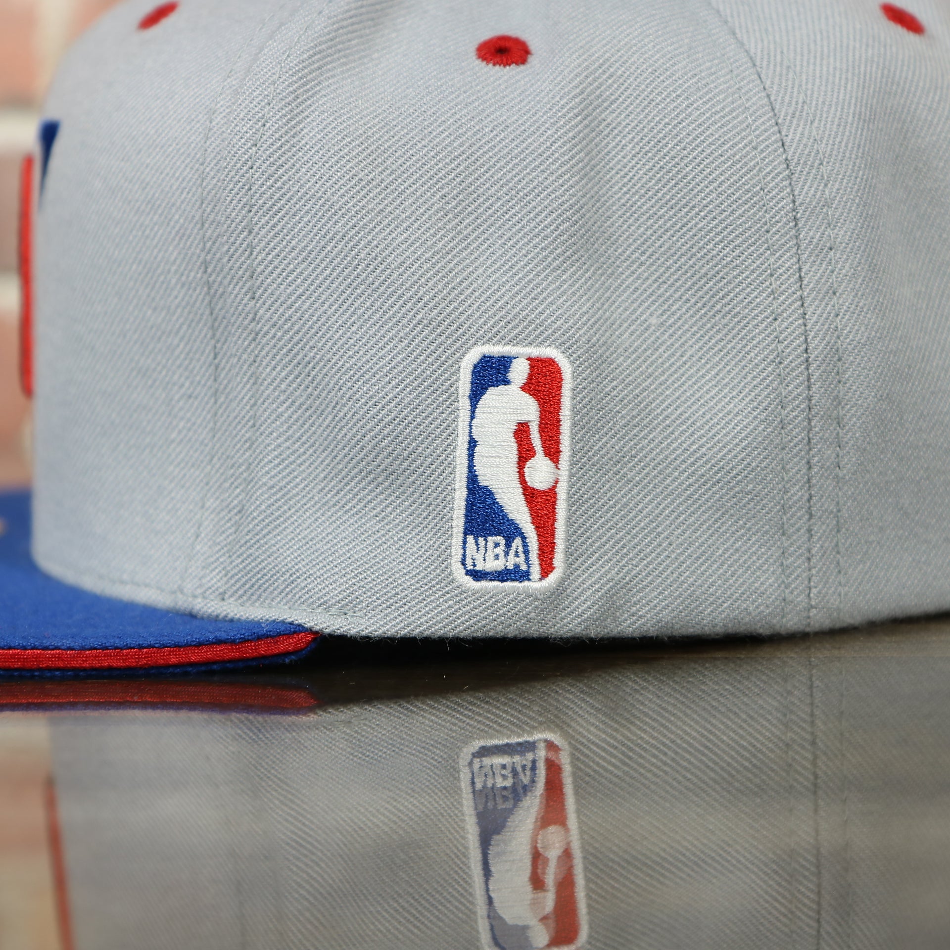 nba logo on the side of the Los Angeles Clippers Vintage Logo Adjustable Snapback with Blue Under visor | Grey OSFM