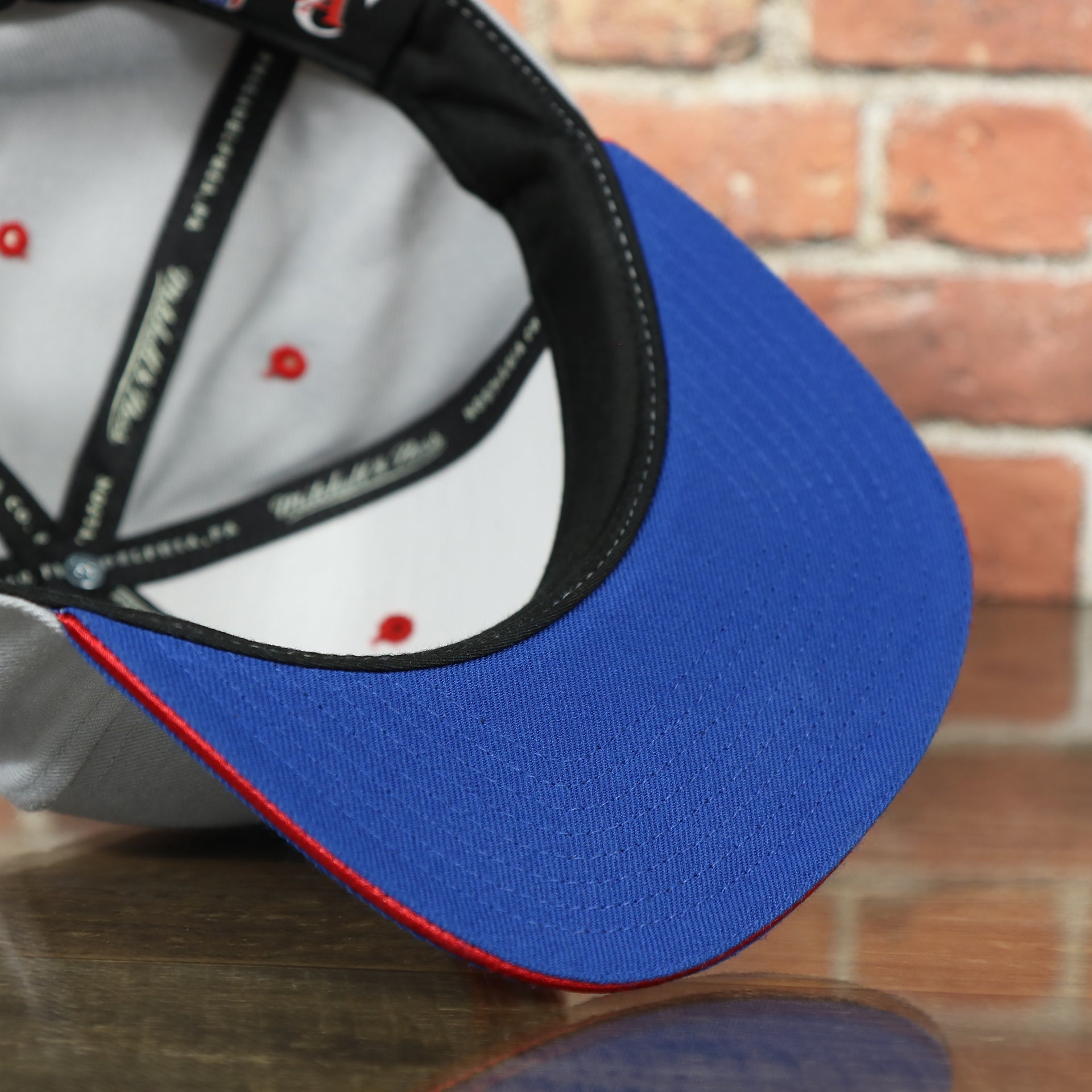 underside of the Los Angeles Clippers Vintage Logo Adjustable Snapback with Blue Under visor | Grey OSFM