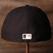 the backside of this cap has the mlb logo in yankees colors Yankees Black Bottom Fitted Cap | New York Yankees On-Field Black Underbrim Fitted Hat