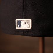 the MLB logo is white navy and silver, for the yankees colors Yankees Black Bottom Fitted Cap | New York Yankees On-Field Black Underbrim Fitted Hat