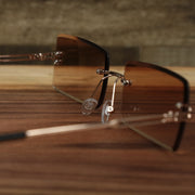 The inside of the Rectangle Frame Brown Lens Sunglasses with Gold Frame