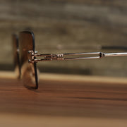 The hinge on the Rectangle Frame Brown Lens Sunglasses with Gold Frame