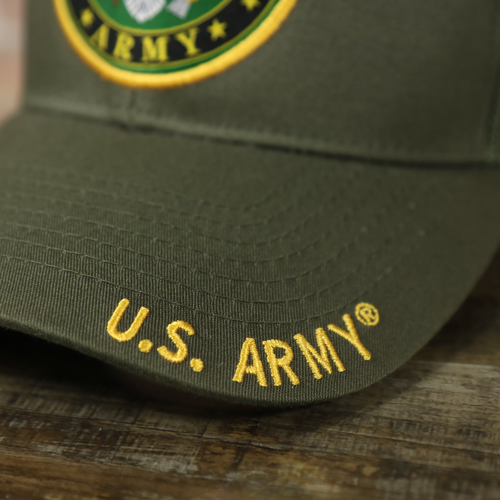 us army name on the brim of the US Army Seal Logo Mesh Back Olive Trucker Snapback Hat | Olive OSFM