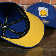 yellow under visor on the Golden State Warriors Dry Poly Blue Dad Hat