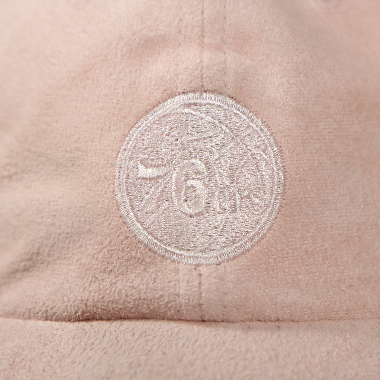 76ers logo on the Philadelphia 76ers Micro Suede Pink Adjustable Baseball Cap