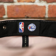 NBA label on the Philadelphia 76ers Micro Suede Pink Adjustable Baseball Cap