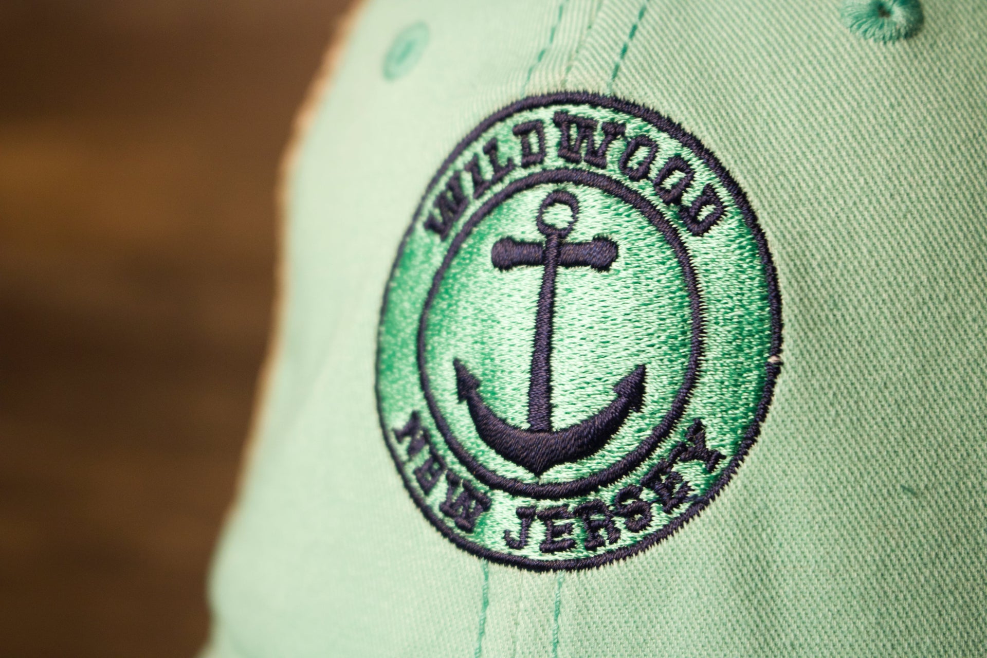the anchor is in the middle of the text Wildwood New Jersey Mint Green / Khaki Mesh-Back Trucker Hat