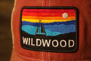 the wildwood logo has many clors for the sunset and a boat Wildwood kid's hat | Youth Wildwood NJ Cardinal Mesh-back Trucker Hat