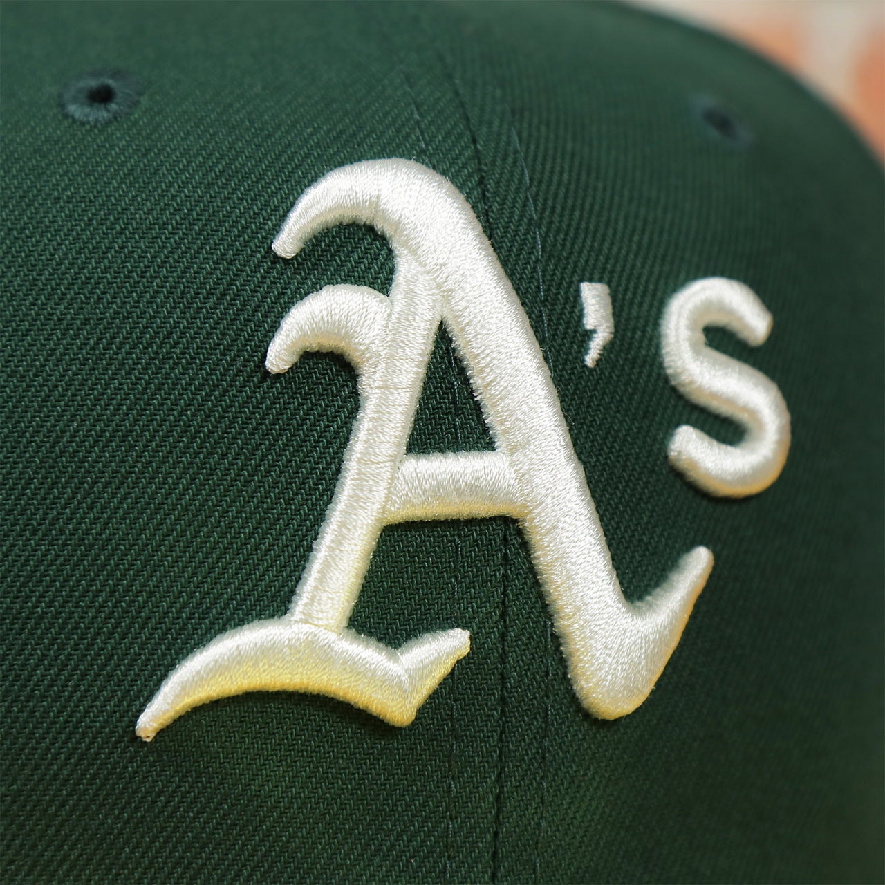 athletics logo on the Oakland Athletics Pop Sweat Pastel World Series Side Patch Fitted Cap With Purple Undervisor | Green 59Fifty Cap