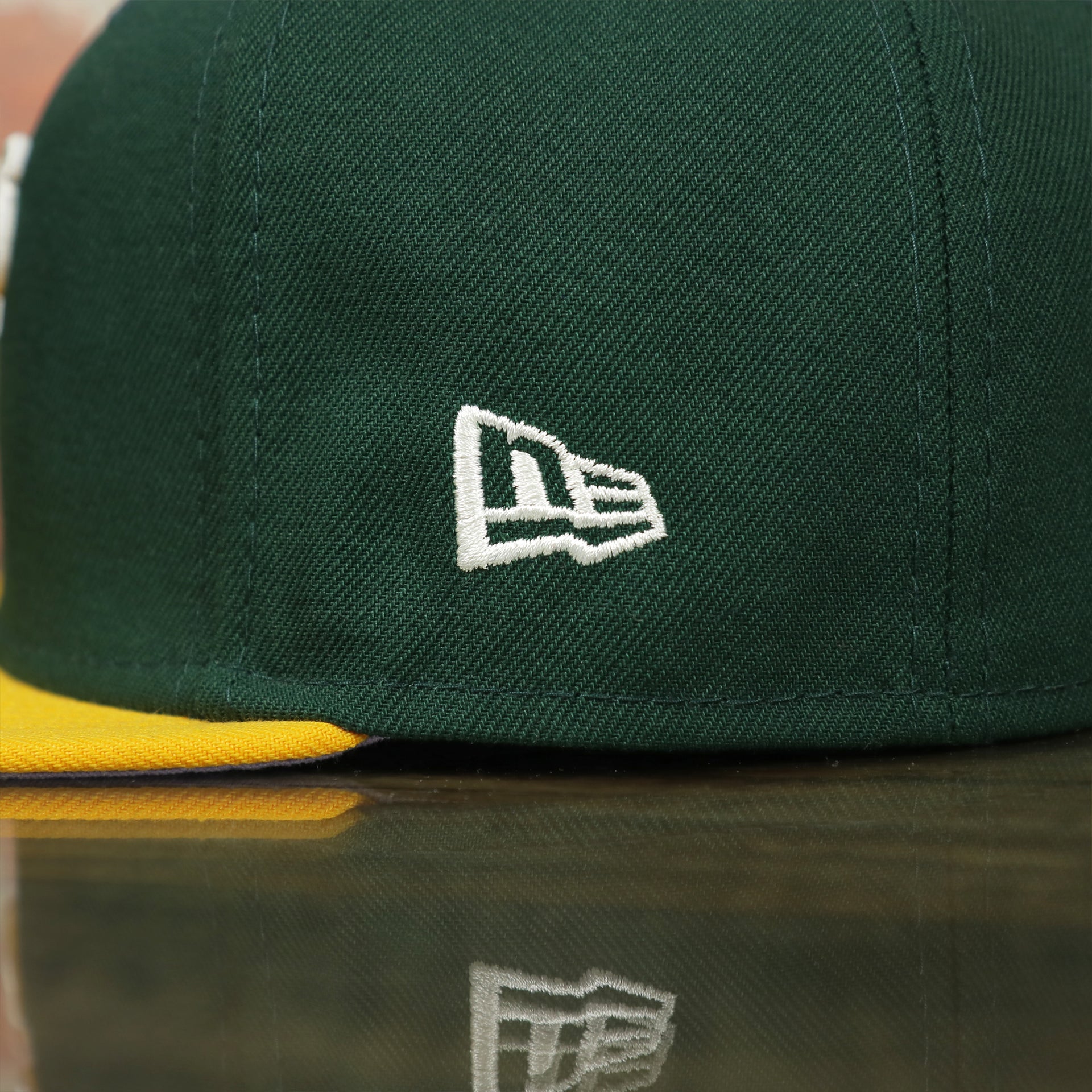 new era logo on the Oakland Athletics Pop Sweat Pastel World Series Side Patch Fitted Cap With Purple Undervisor | Green 59Fifty Cap