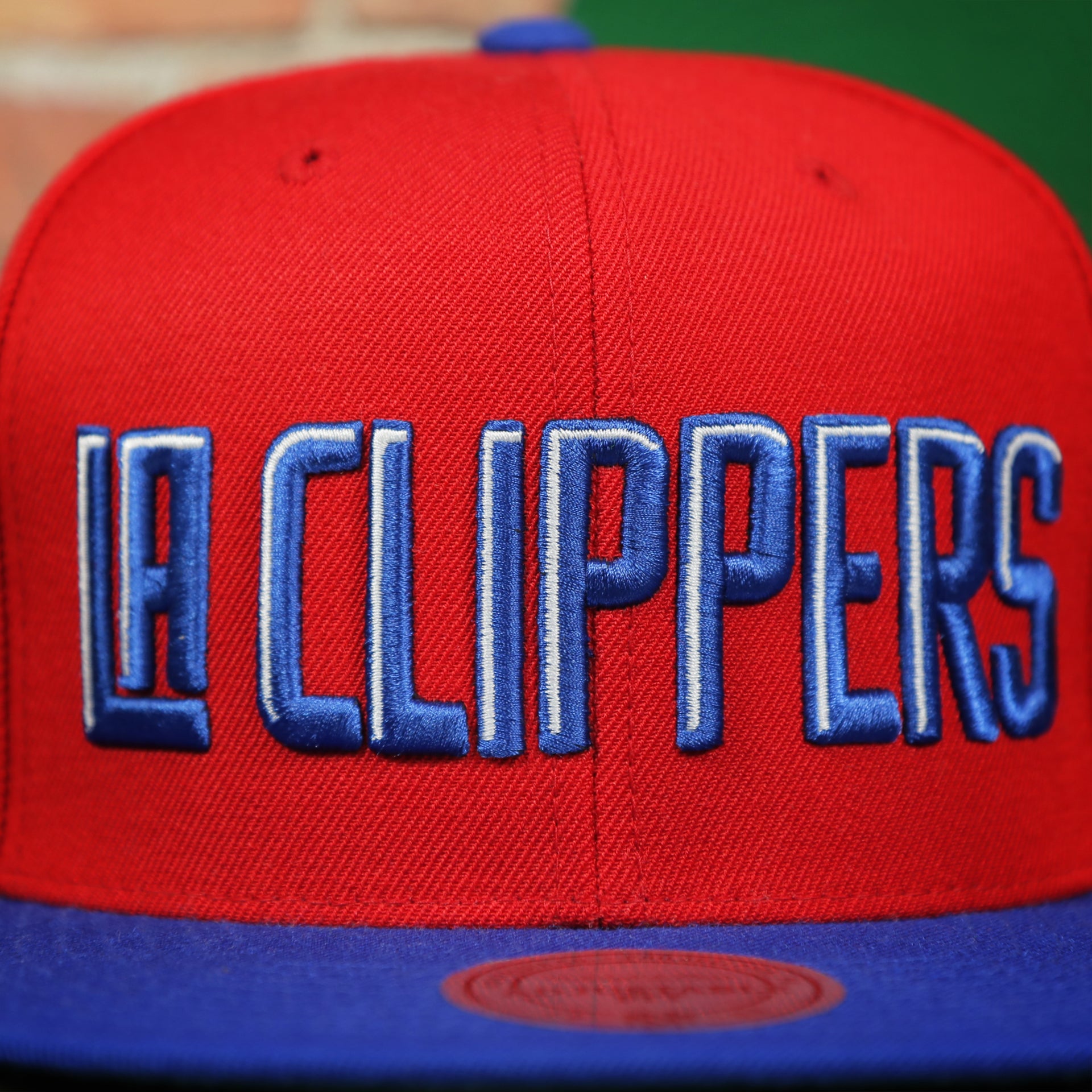 clippers lettering on the Los Angeles Clippers XL Logo Red Snapback Hat | LA Clippers Big Logo Green Bottom Snap Back