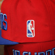 NBA label on the Los Angeles Clippers XL Logo Red Snapback Hat | LA Clippers Big Logo Green Bottom Snap Back