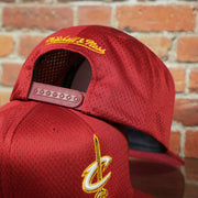 maroon adjustable snap on the Cleveland Cavaliers Maroon Mesh Jersey Snapback Hat
