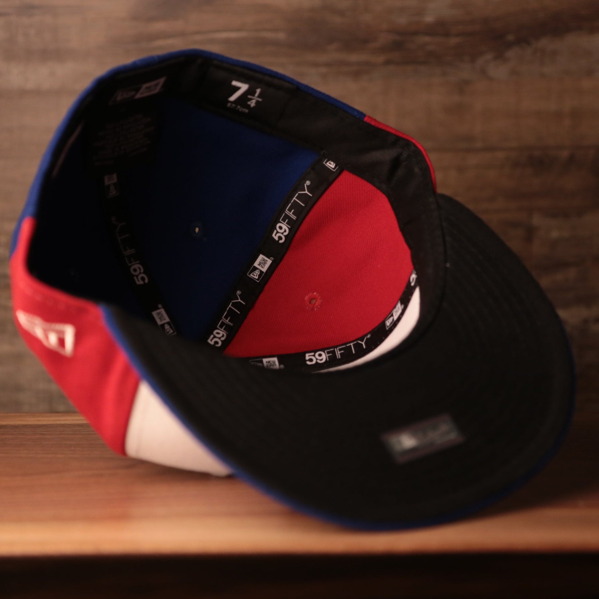 The inside of the New Era 59fifty with a black underbrim made for the Expos.