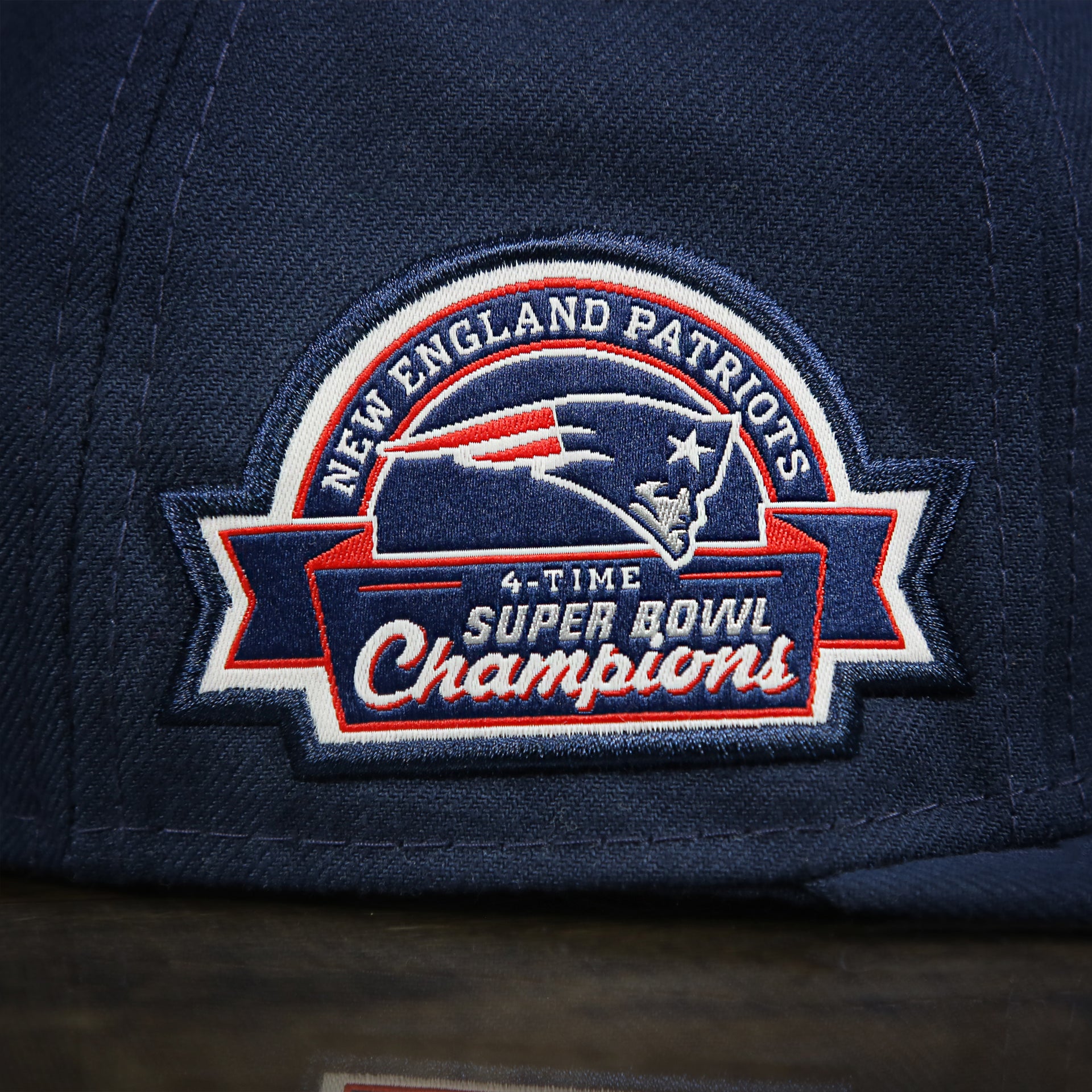 super bowl champion patch on the New England Patriots Throwback 4X Super Bowl Champions Snapback Hat