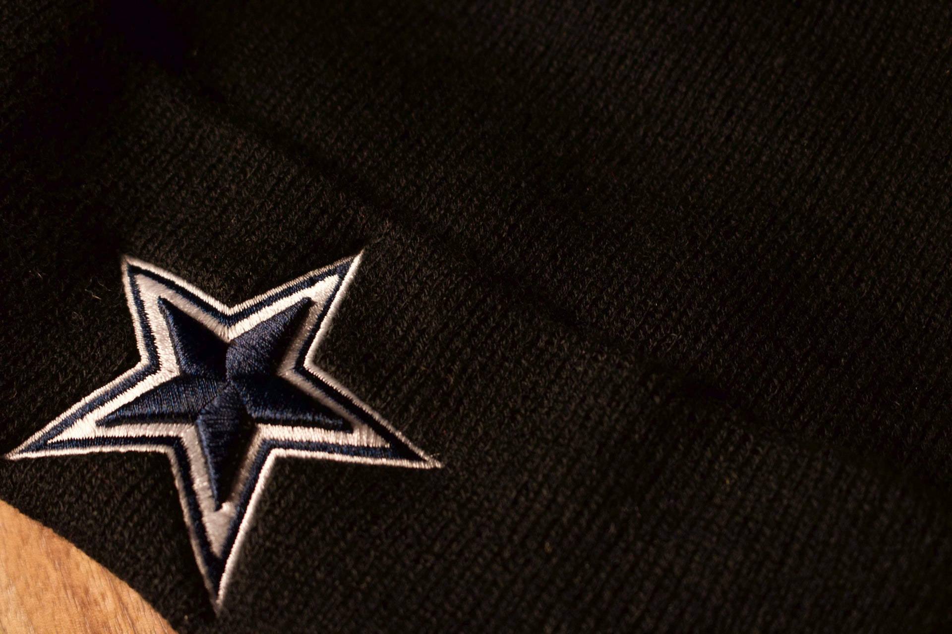 the hat is all black with a black pom Cowboys Beanie | Dallas Cowboys Navy BLue Beanie | OSFM