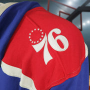 76ers logo on wearers left on the Philadelphia 76ers Vintage Hockey 47 Lacer Hoodie |  Blue, Red, White