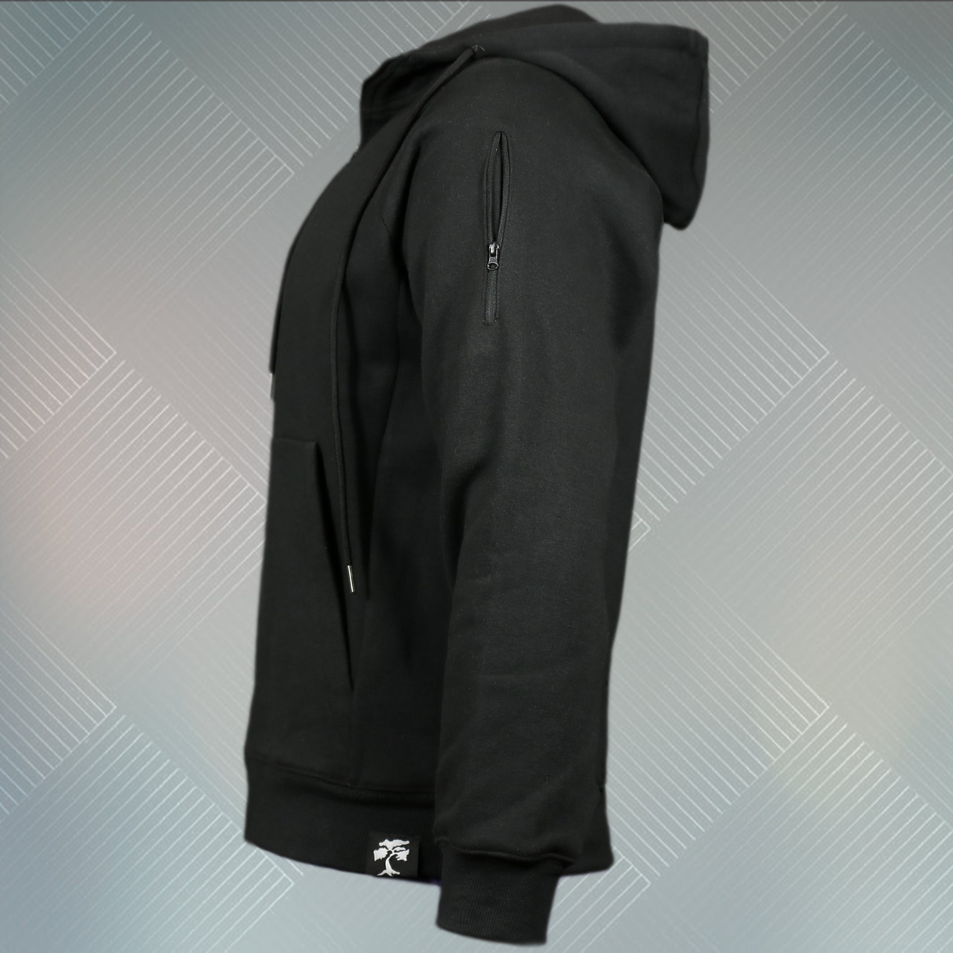 wearers left of the Jet Black Unbasic Fleece Stash Pocket Sunset Park Tapered Zipper Hoodie | Fleece Black Hoodie