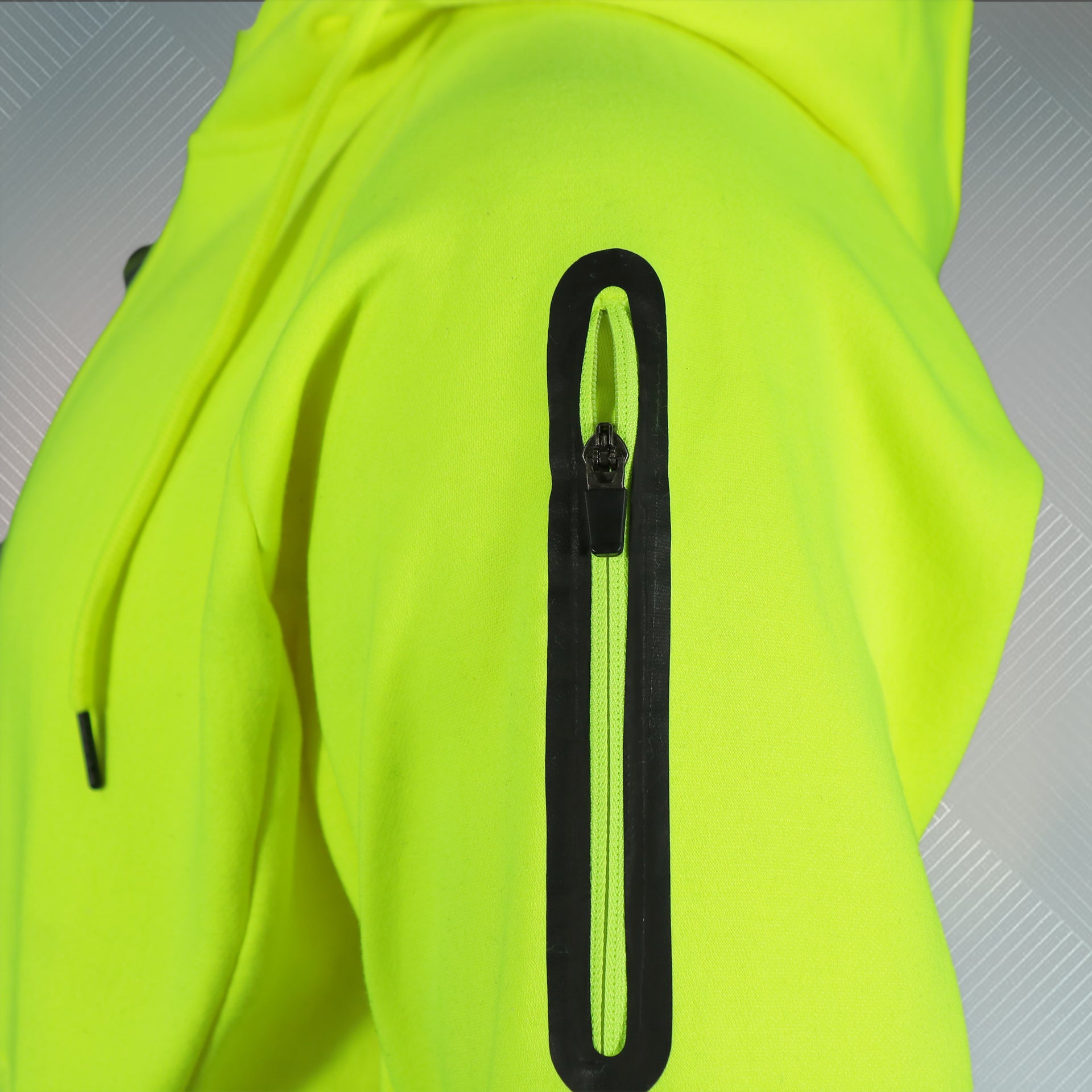 arm pocket on the Frozen Yellow Unbasic Fleece Stash Pocket Sunset Park Tapered Zipper Hoodie | Fleece Neon Yellow Hoodie
