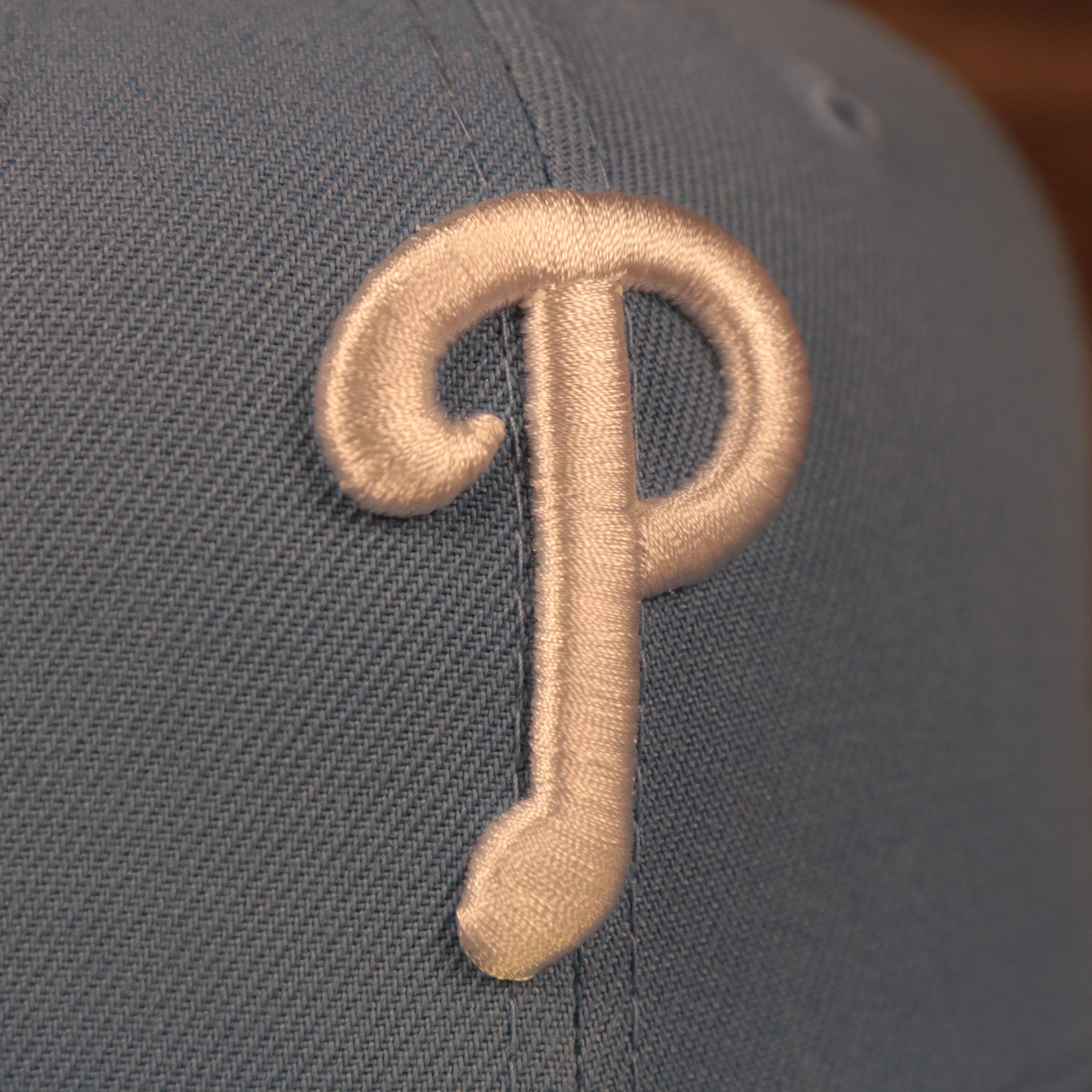 Close up of the Philadelphia Phillies logo on the Philadelphia Phillies 1996 All Star Game Icy Blue Pink Bottom Side Patch 59Fifty Fitted Cap