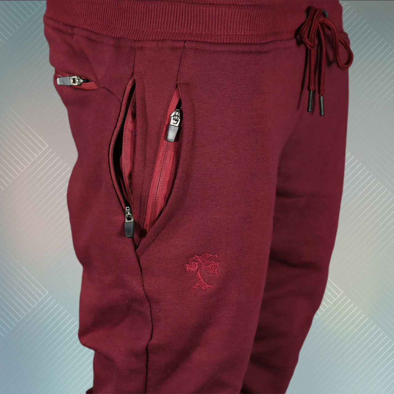 wearers right of the Maroon Unbasic Fleece Stash Pocket Sunset Park Tapered Jogger Pants | Fleece Dark Red Sweatpants